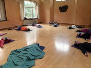 Yoga class in Shavasana