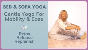 woman sitteing on a pink rug doing gentle yoga