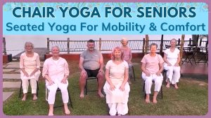 Yoga students seated on chairs in India ready to do yoga