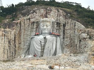 Buddha carving into Sam Mountain Vietnam